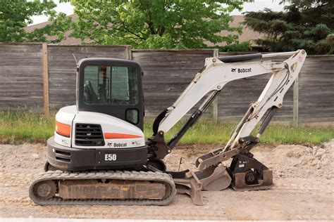 using mini excavator|operating a bobcat mini excavator.